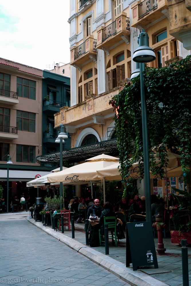 People enjoying coffee at a sidewalk café in Ladadika, Thessaloniki, Greece